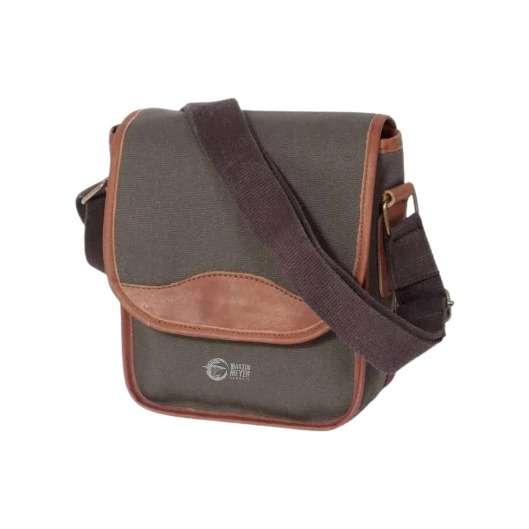 Green canvas messenger bag with brown leather accents and strap.