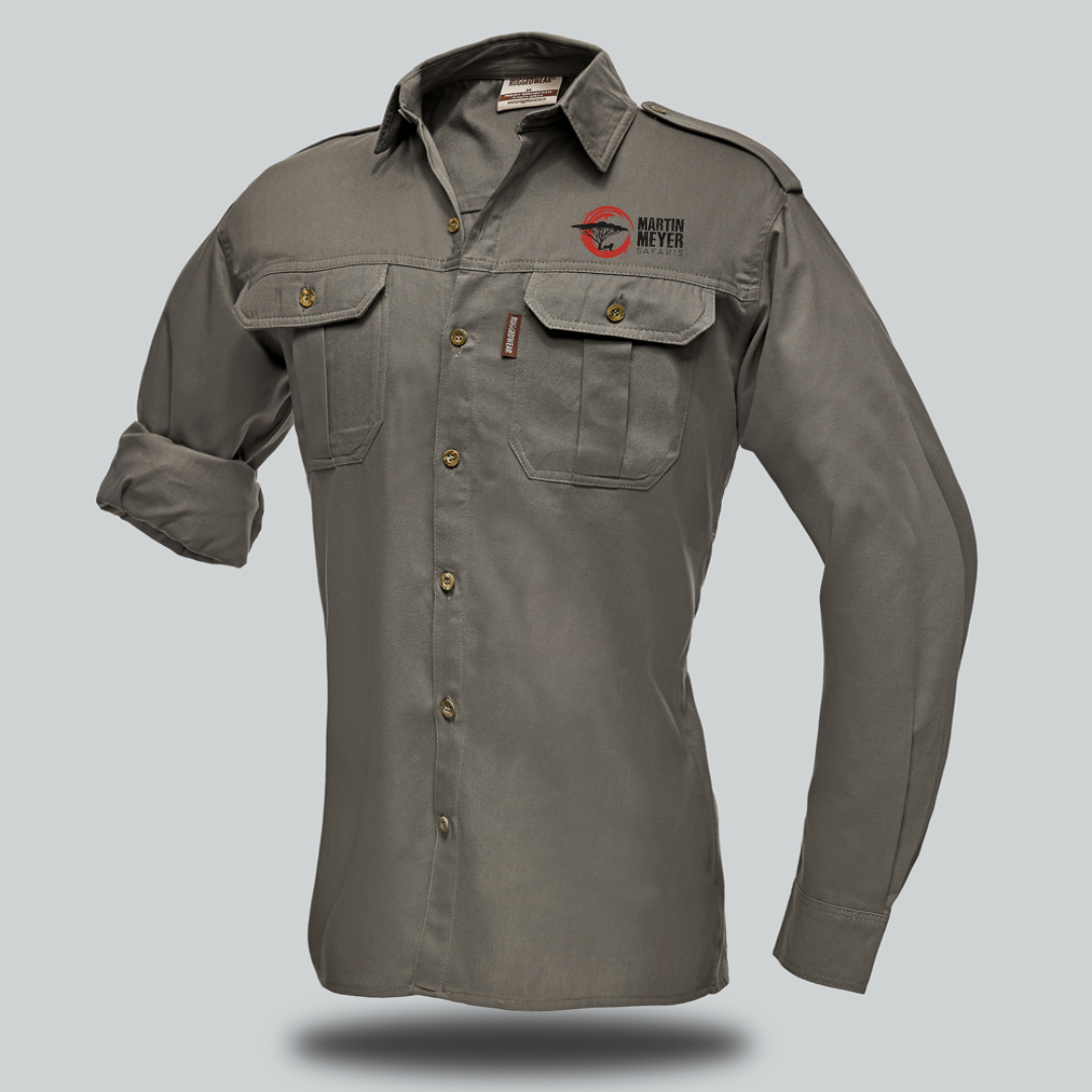 A khaki long-sleeved button-down shirt with two chest pockets, logos on the chest and shoulder, and a rolled-up sleeve.
