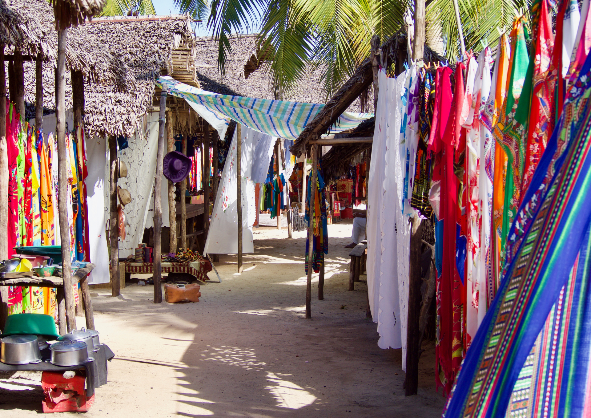 A row of colorful clothes hanging on a clothes line
