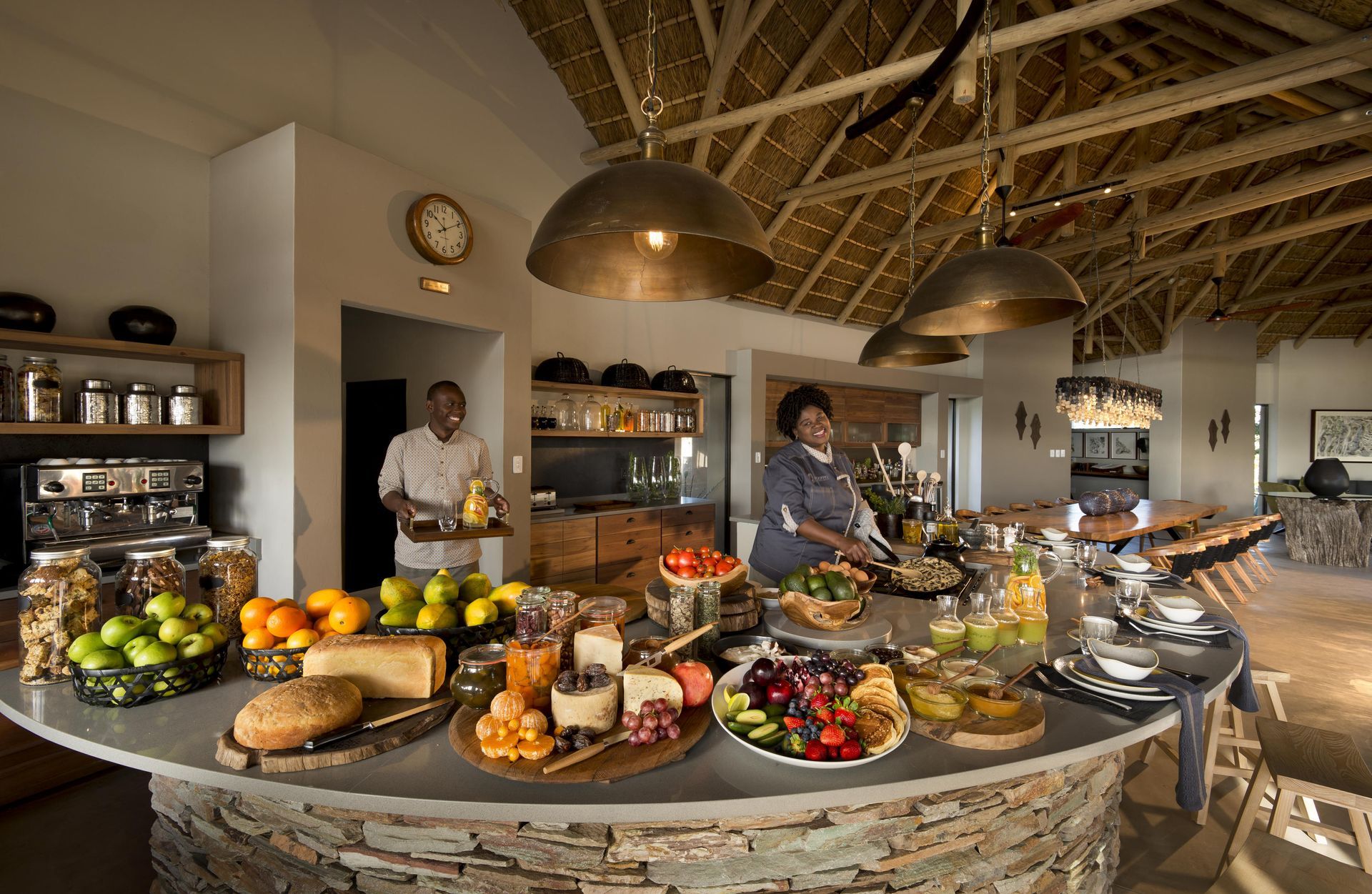A man and a woman are preparing food at Rockfig Safari Lodge