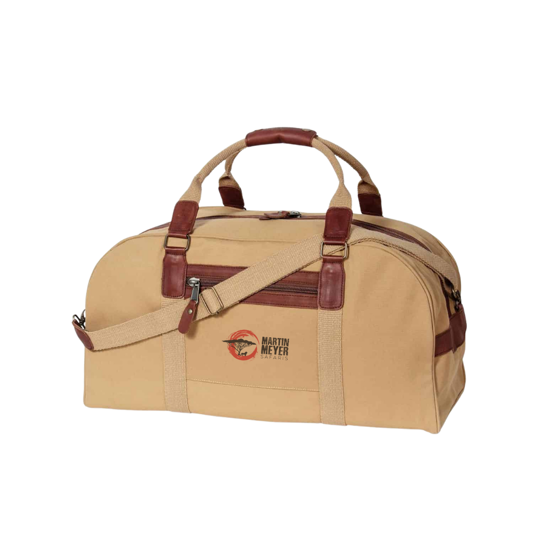 Tan and brown duffel bag with leather accents and logo.