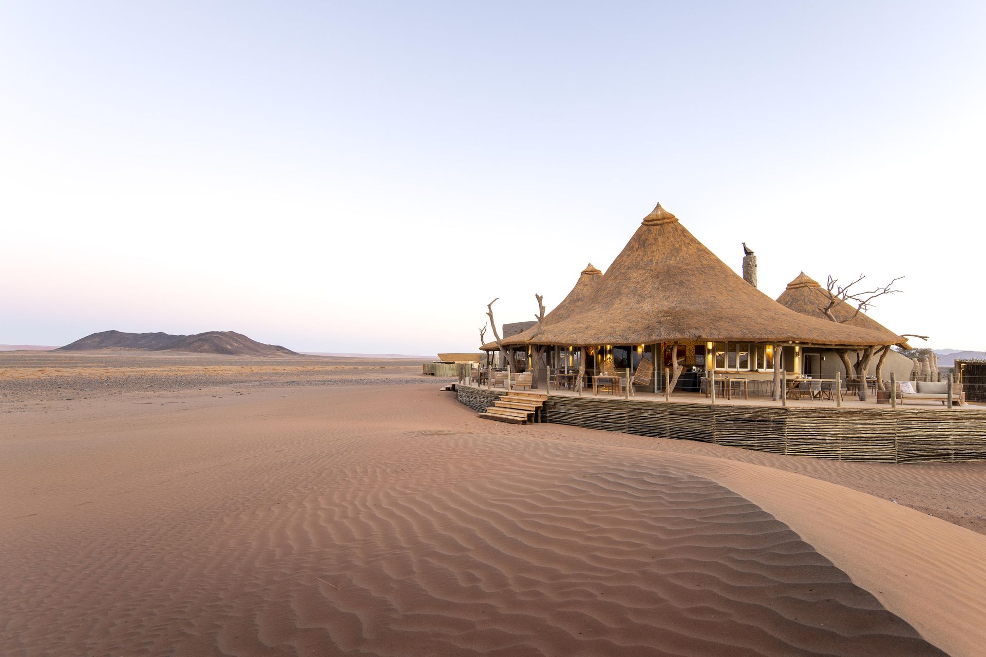 A thatched hut in the middle of a desert. Namibia Safari