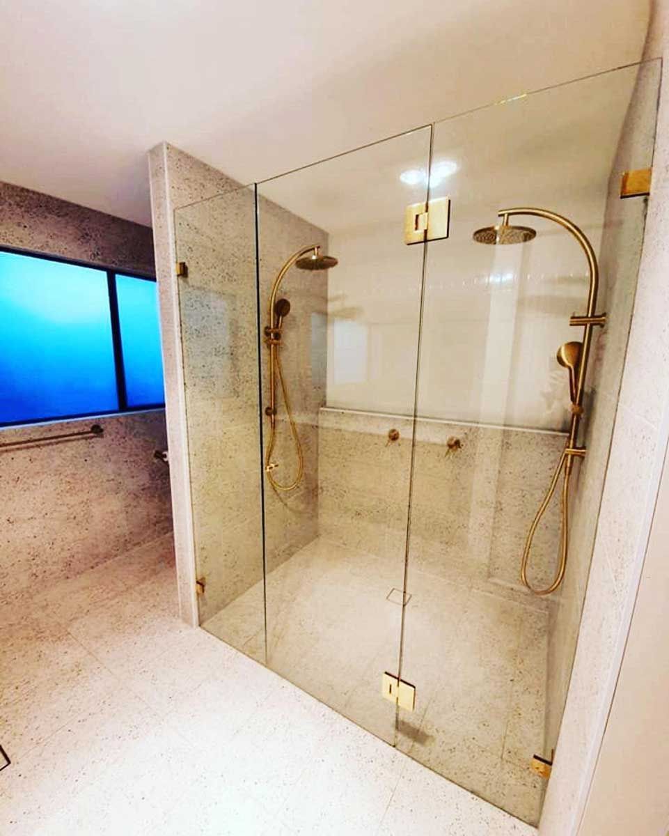 A Bathroom With A Walk In Shower With A Glass Door — Todd Williams Plumbing and Gas Fitting In Forster, NSW