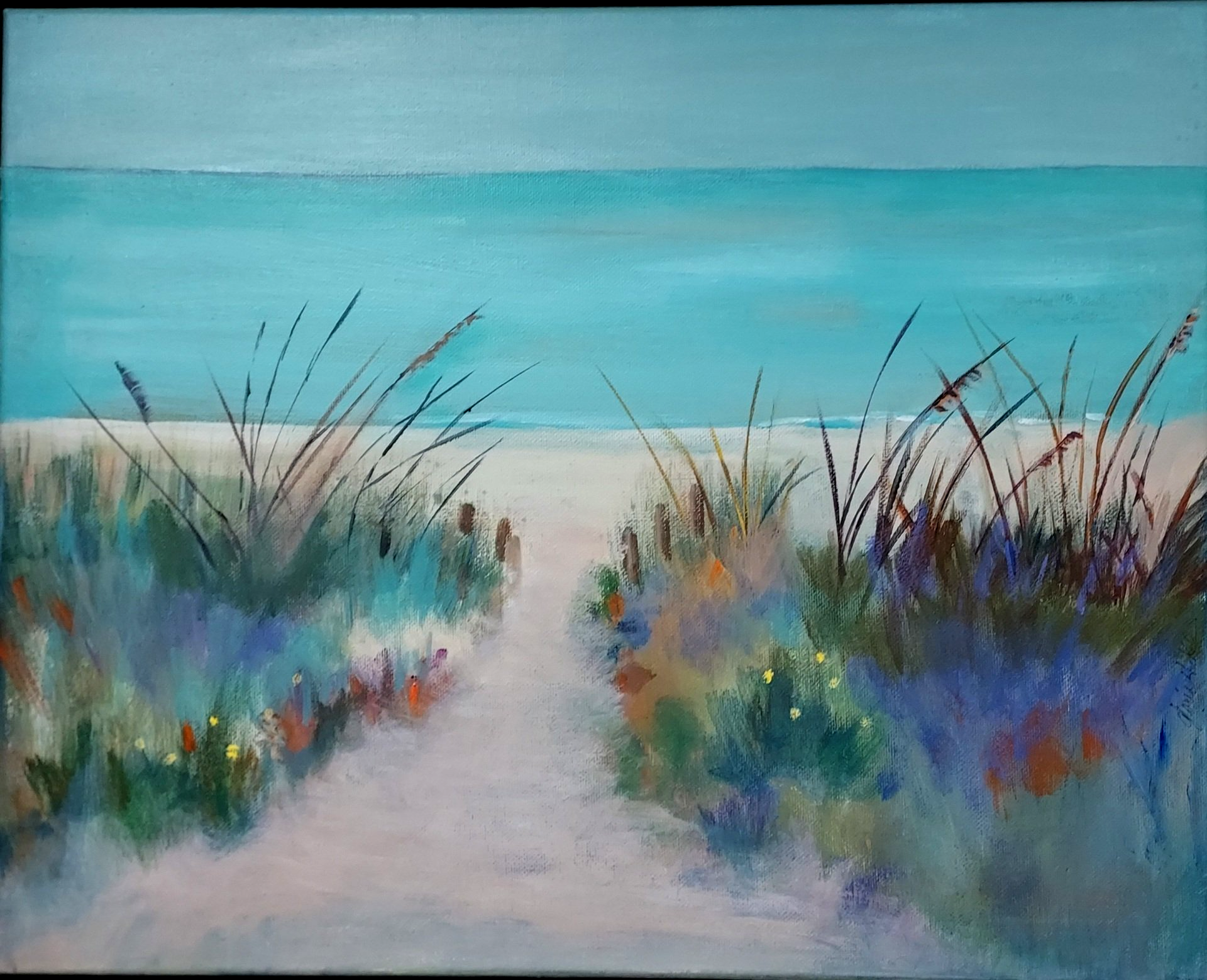 Path to beach through dunes, aqua water and sky.