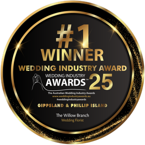 A circular gold and black badge declaring The Willow Branch the #1 Wedding Florist winner for Gippsland & Phillip Island '25.