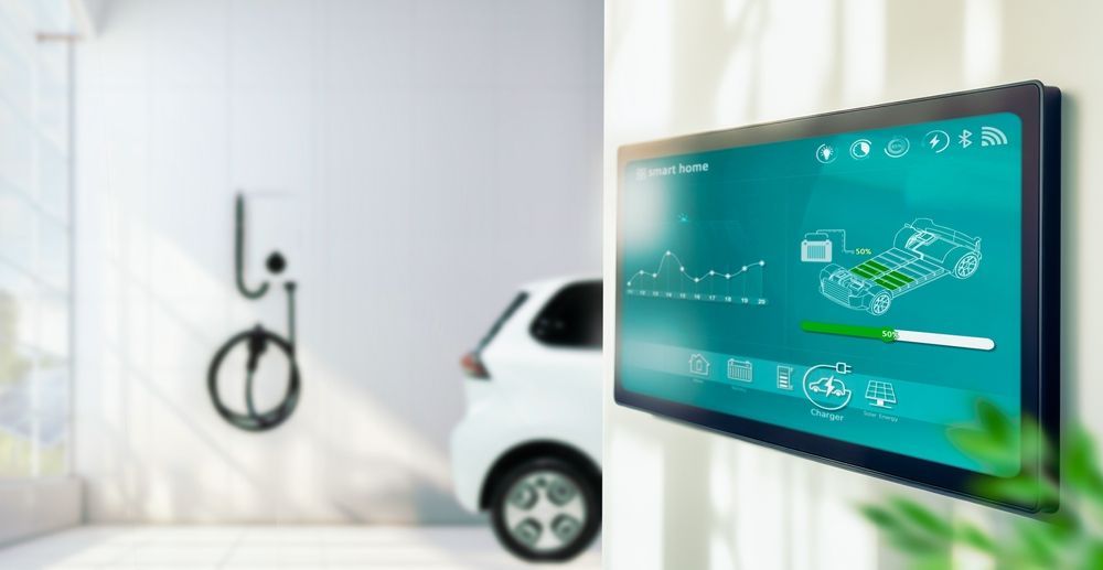 Electric car charging in a bright garage, with a digital energy dashboard in the foreground