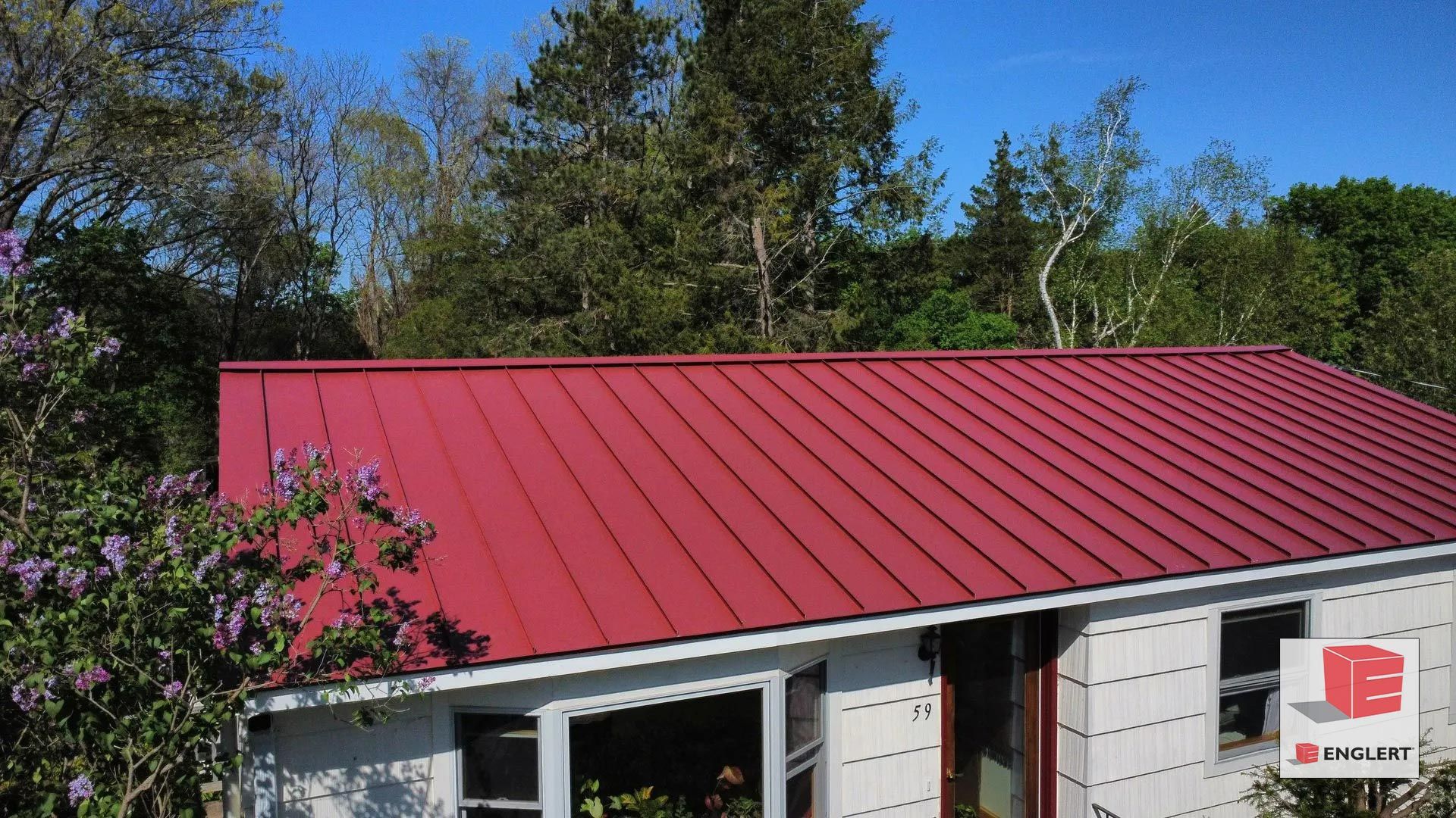 Red standing seam metal roof in Amherst MA