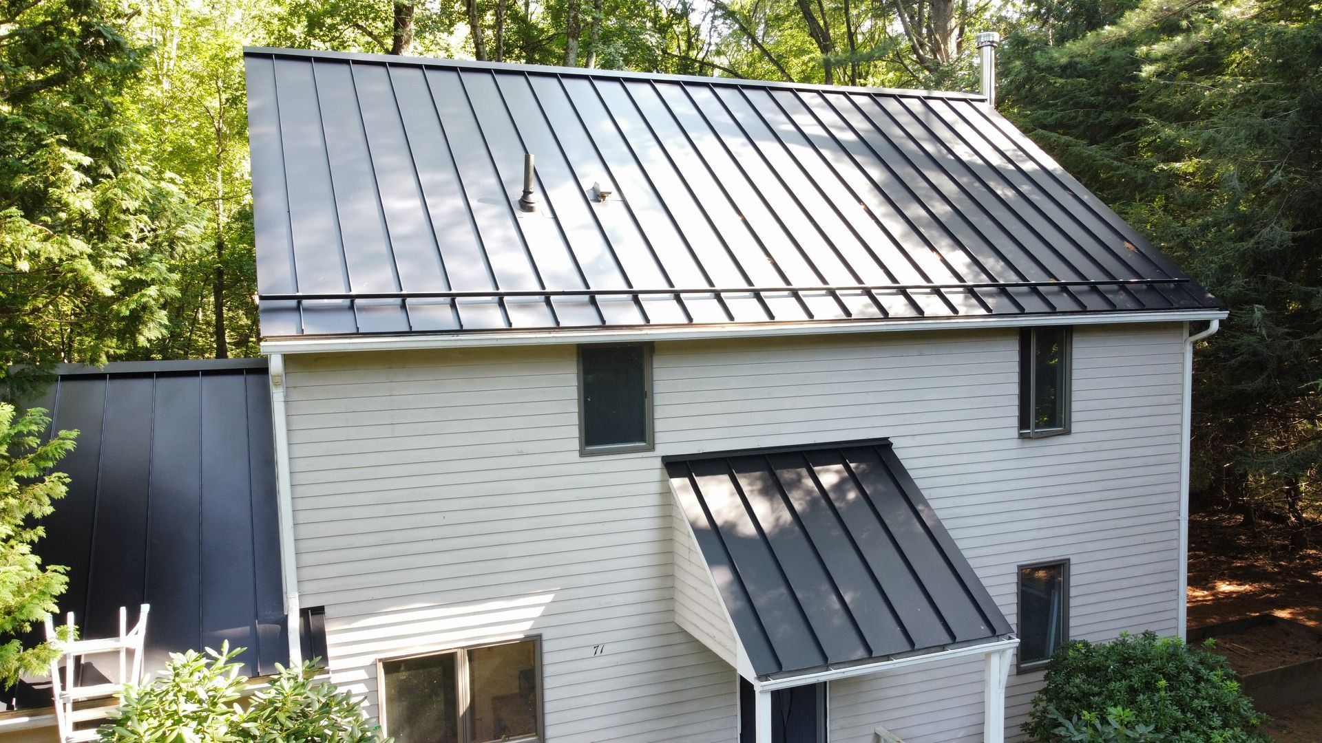 Black standing seam metal roof in Northampton MA