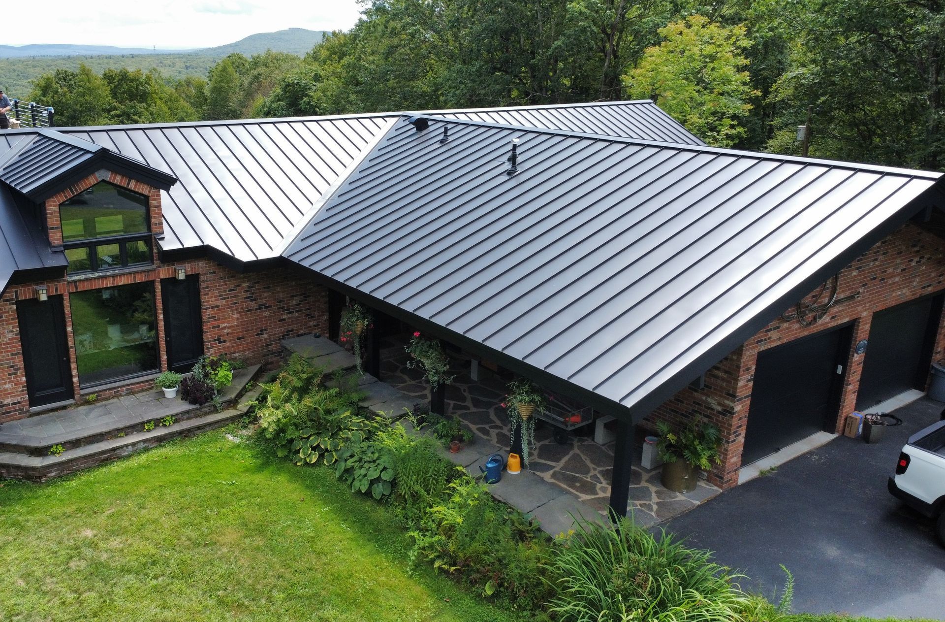 Black standing seam metal roof installed in Westhampton, MA.