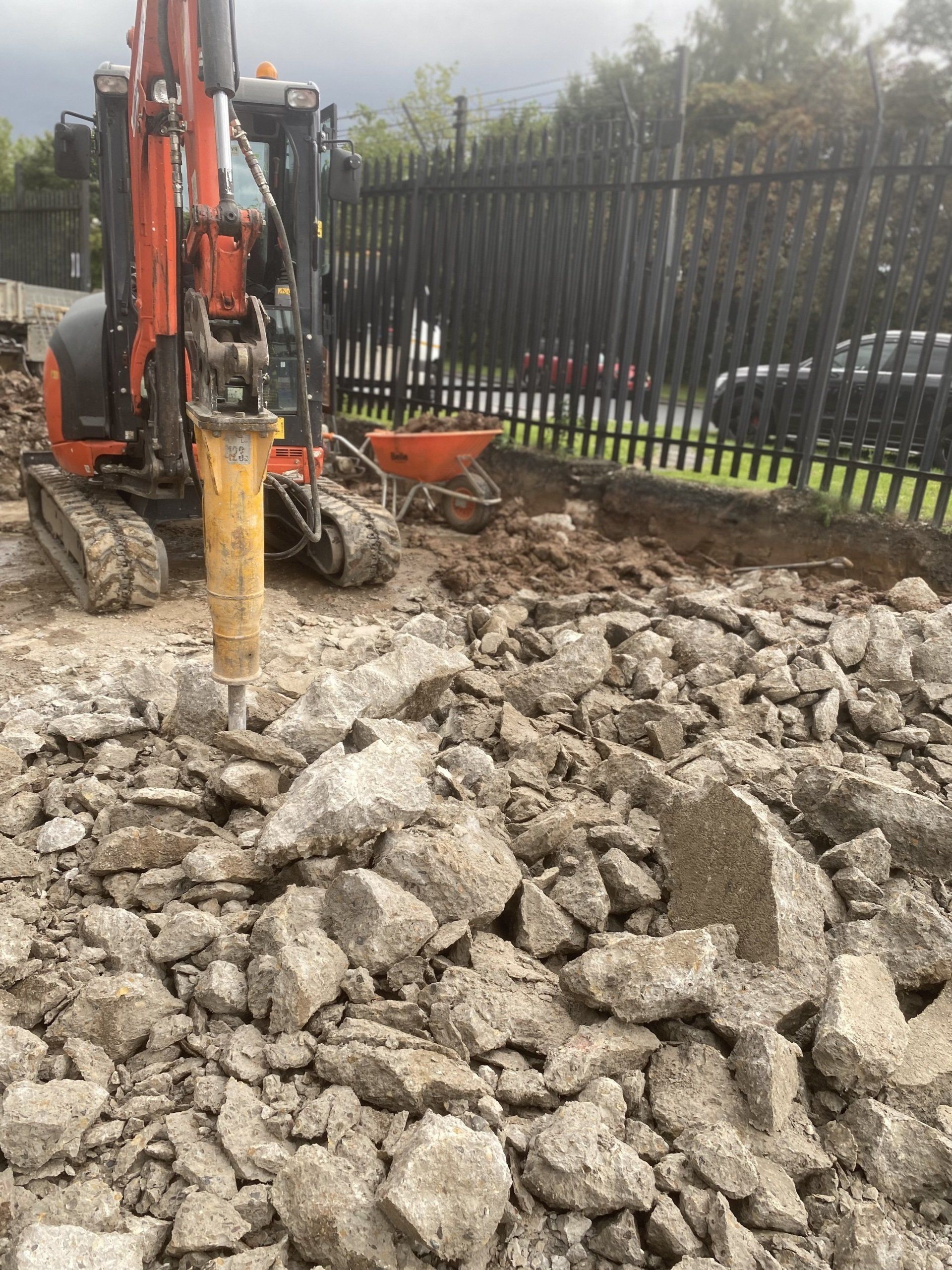 Concrete broken up with hydraulic breaker