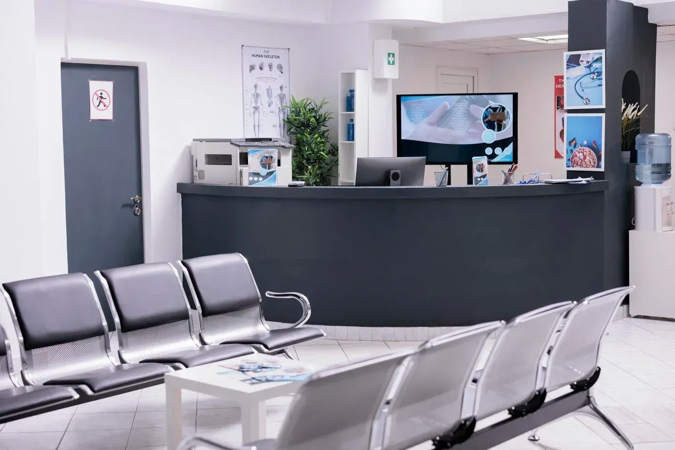 A waiting room with chairs and a counter in a hospital in Los Angeles, CA