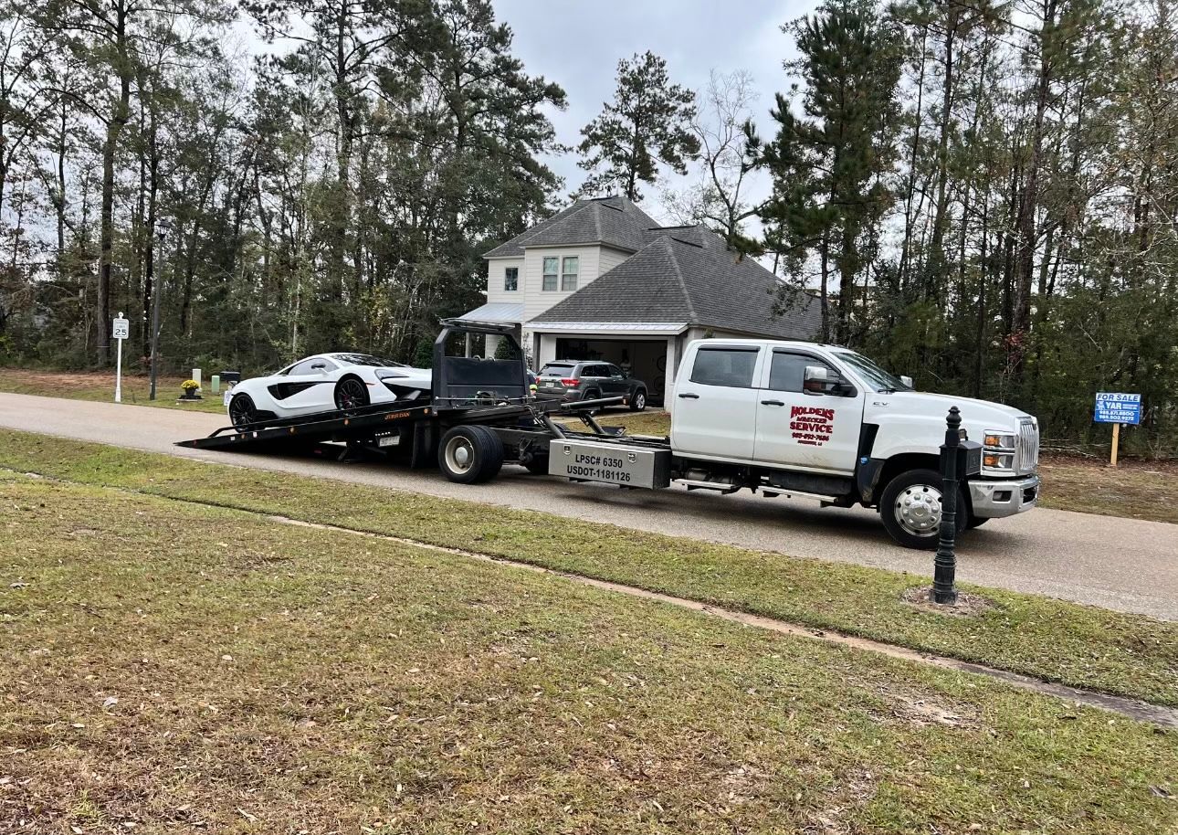 car on holden's wrecker service truck