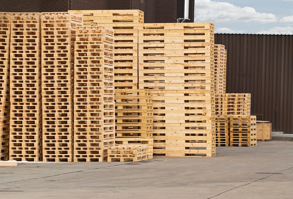 A Bunch of Wooden Pallets Are Stacked on Top of Each Other — Marshall Notaras Hardwoods Pty Ltd In Sydney, NSW