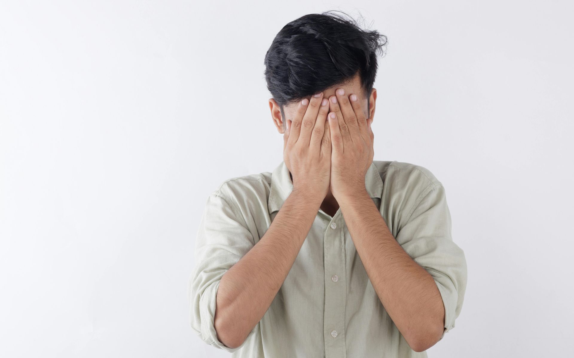 Man with hands on his face upset with his insurance claim payout in Provo Utah