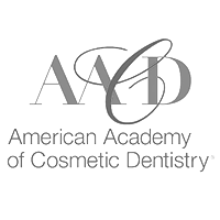 american academy of cosmetic dentistry logo