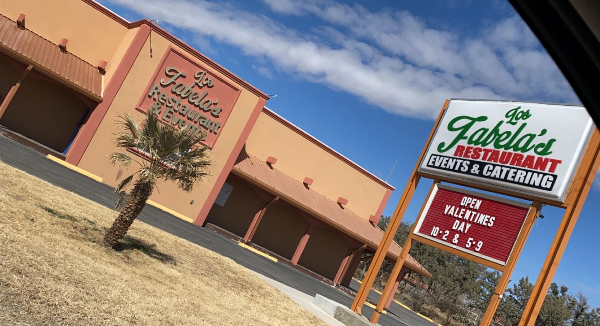 Tan-colored building and a sign for 