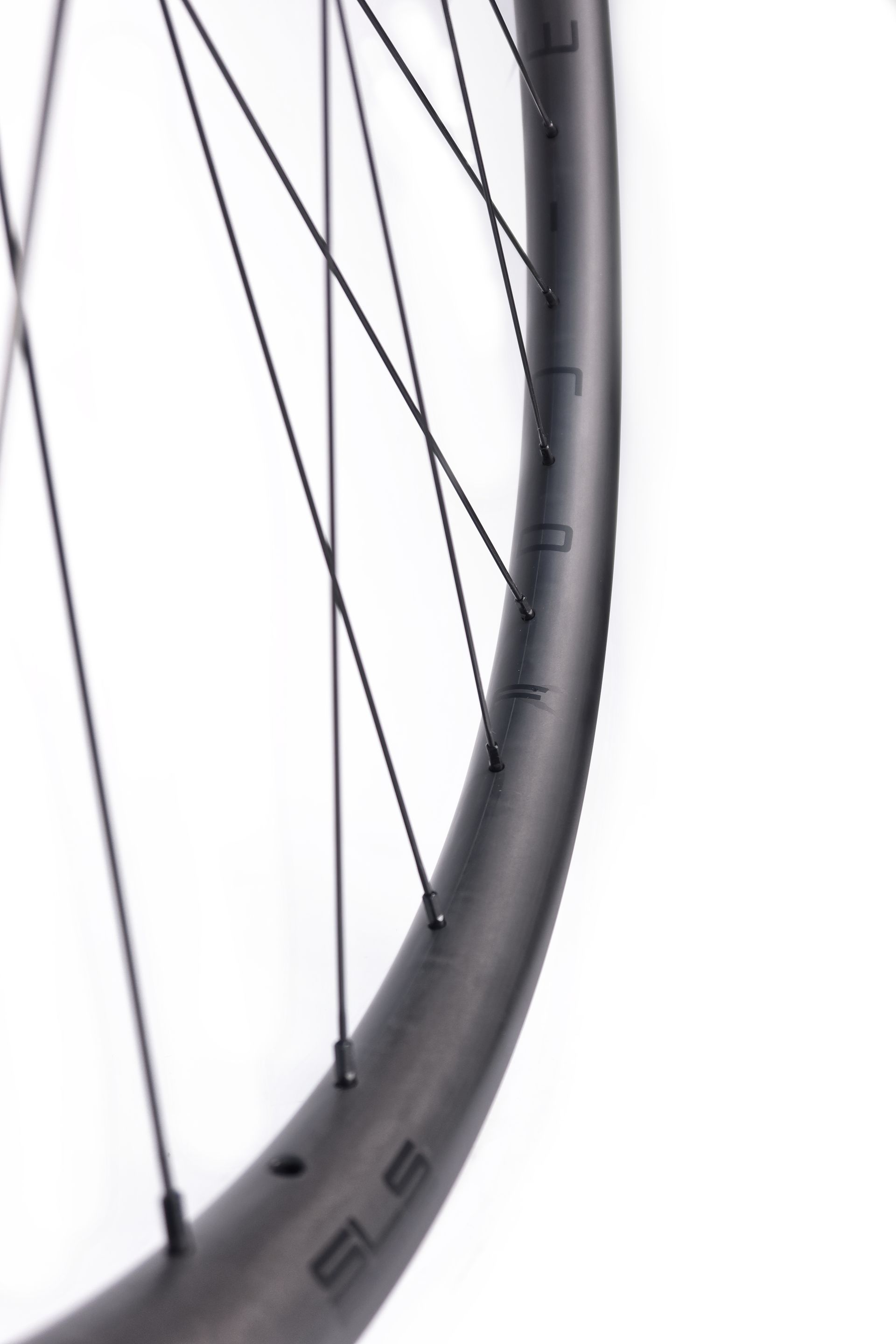 A close up of a wide carbon bike wheel for beach racing