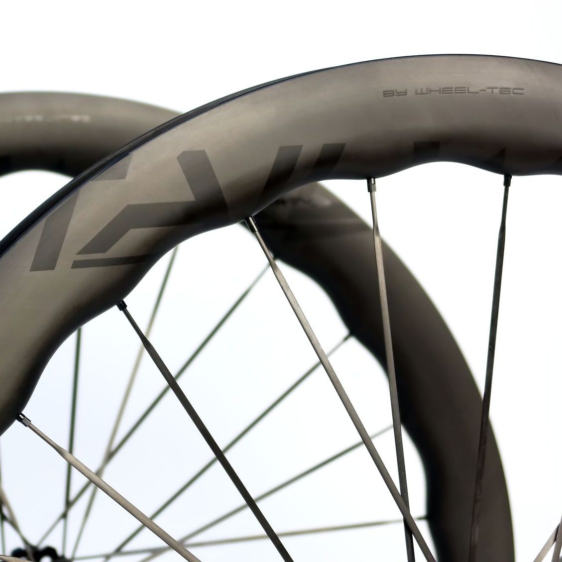 A pair of carbon Tailwind bicycle wheels with waved shape and carbon spokes