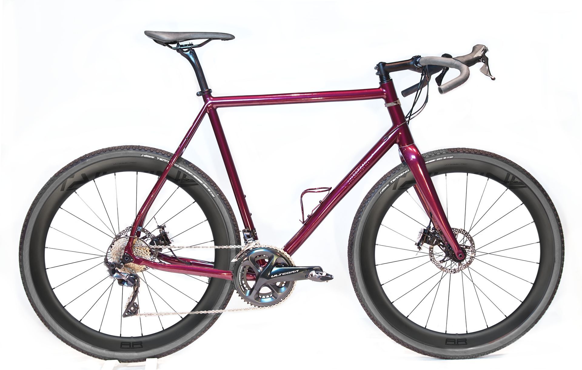 A burgundy Klaassen Multipurpose beach racing bike with tailwind carbon rims