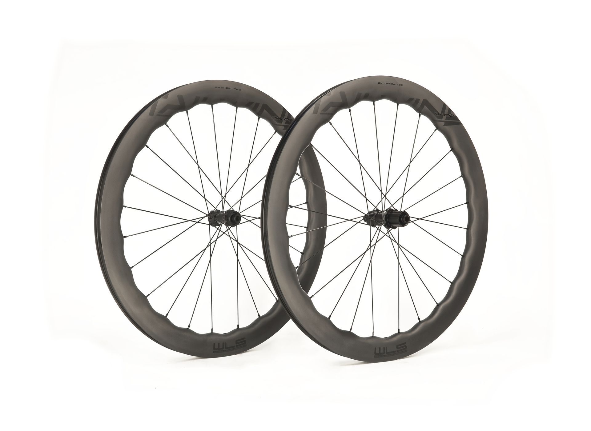 A close up of a tailwind aero waved carbon wheels