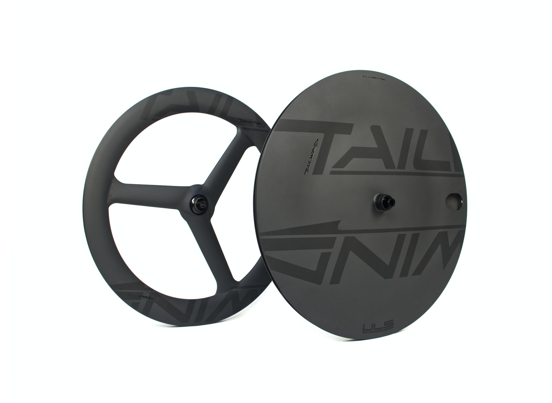 A pair of TT carbon wheels with a trispoke and closed disc bicycle wheel for time trial and triathlon