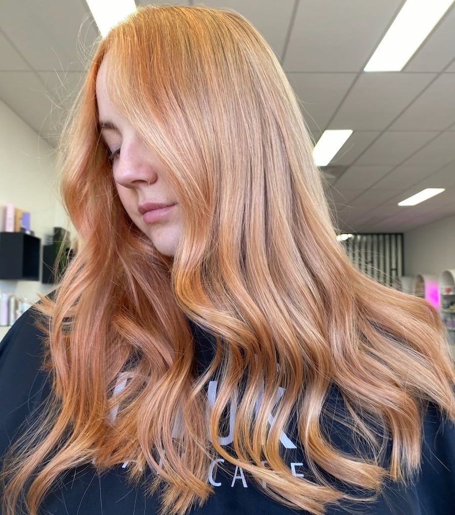 A Woman With Long Red Hair Is Wearing A Black Shirt — Mysa on Flinders In Townsville City, QLD