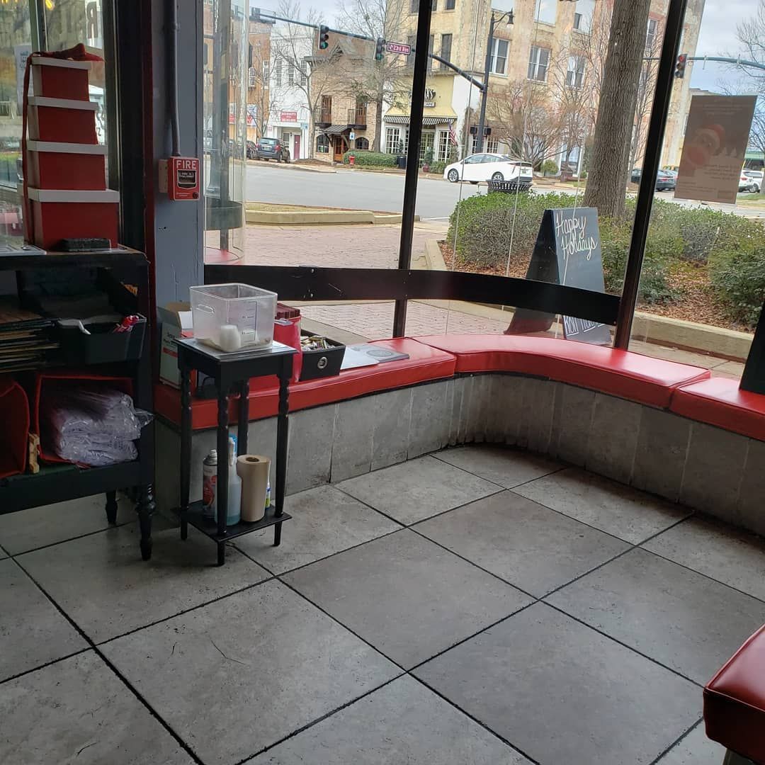 A restaurant with a red chair