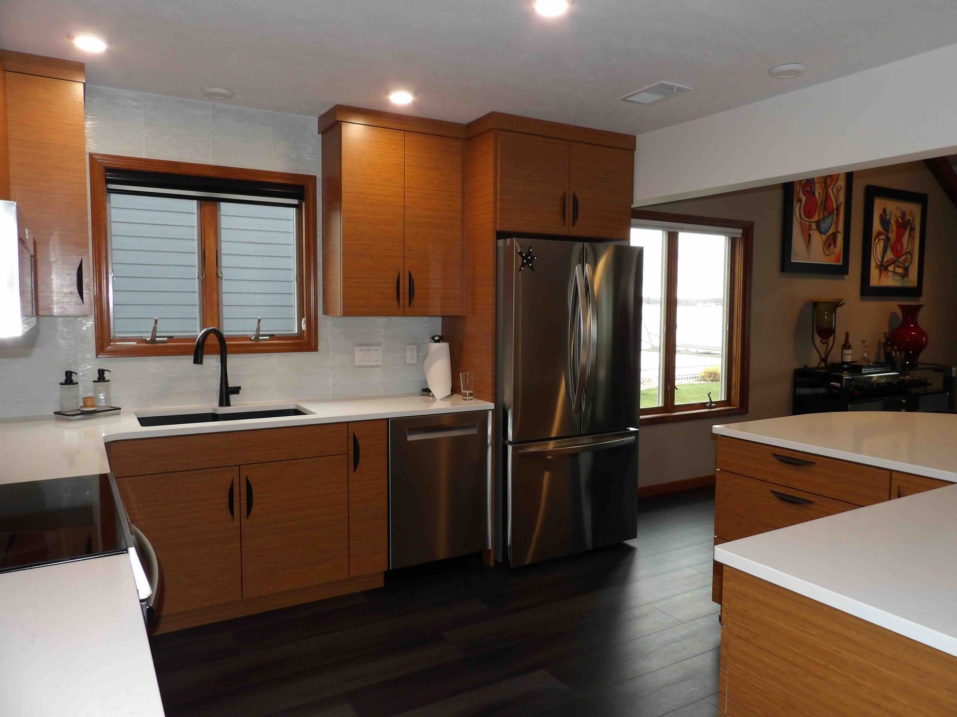 A kitchen with stainless steel appliances and wooden cabinets