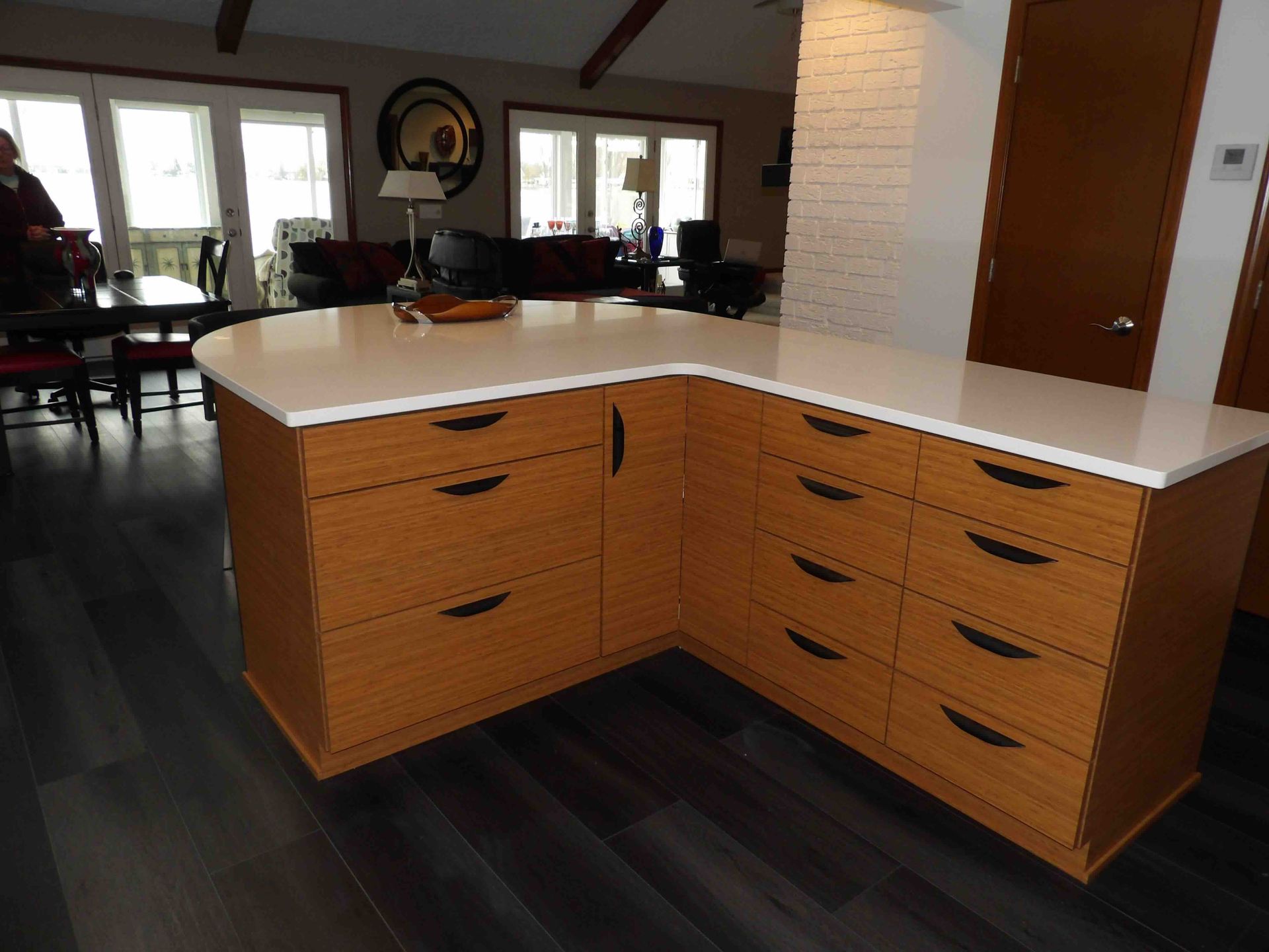 A kitchen with a large island and lots of drawers