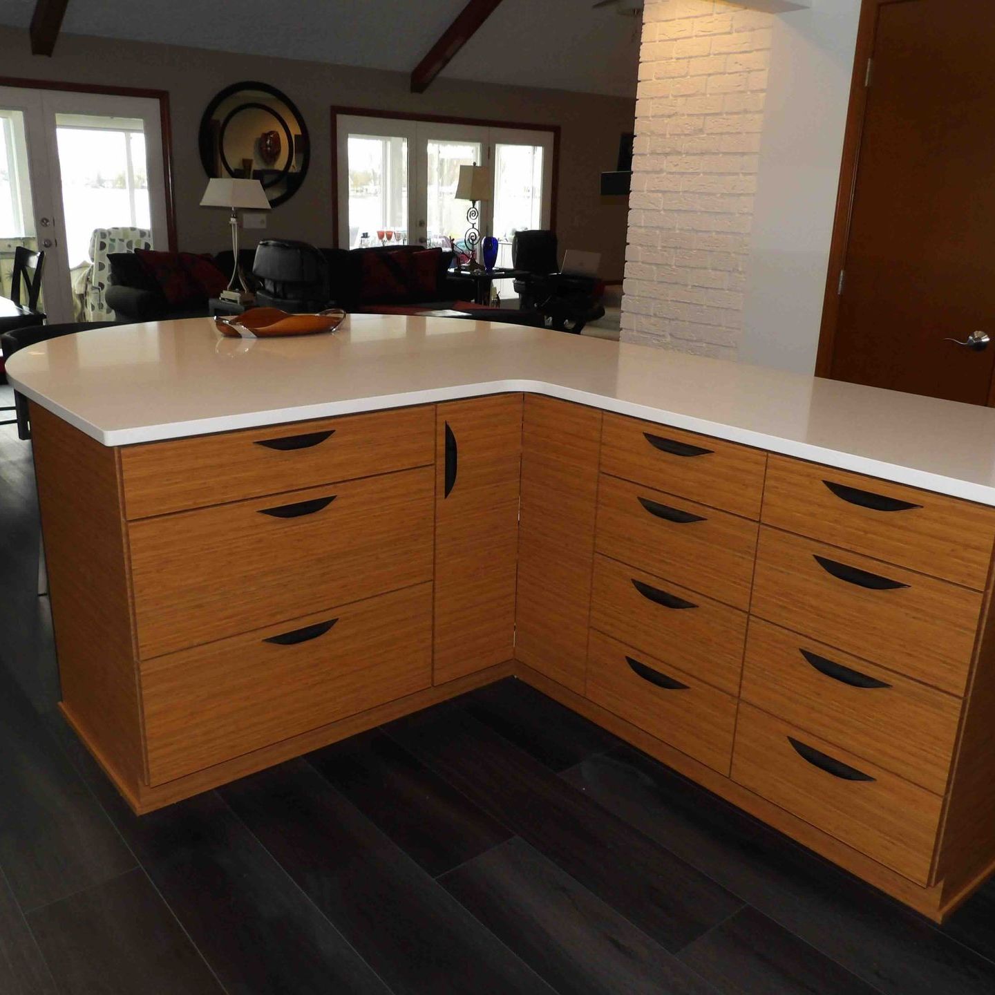 A kitchen with a large island and lots of drawers