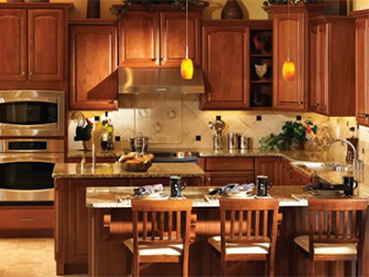 A kitchen with wooden cabinets and stainless steel appliances