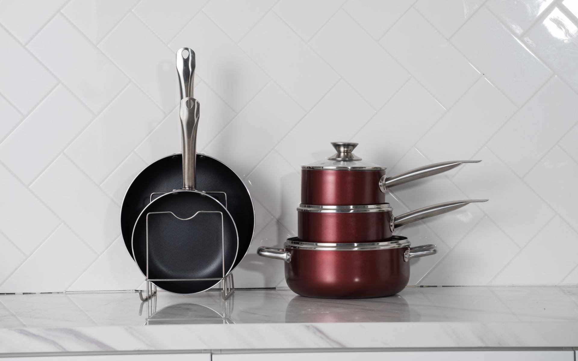 A stack of pots and pans sitting on top of a counter.