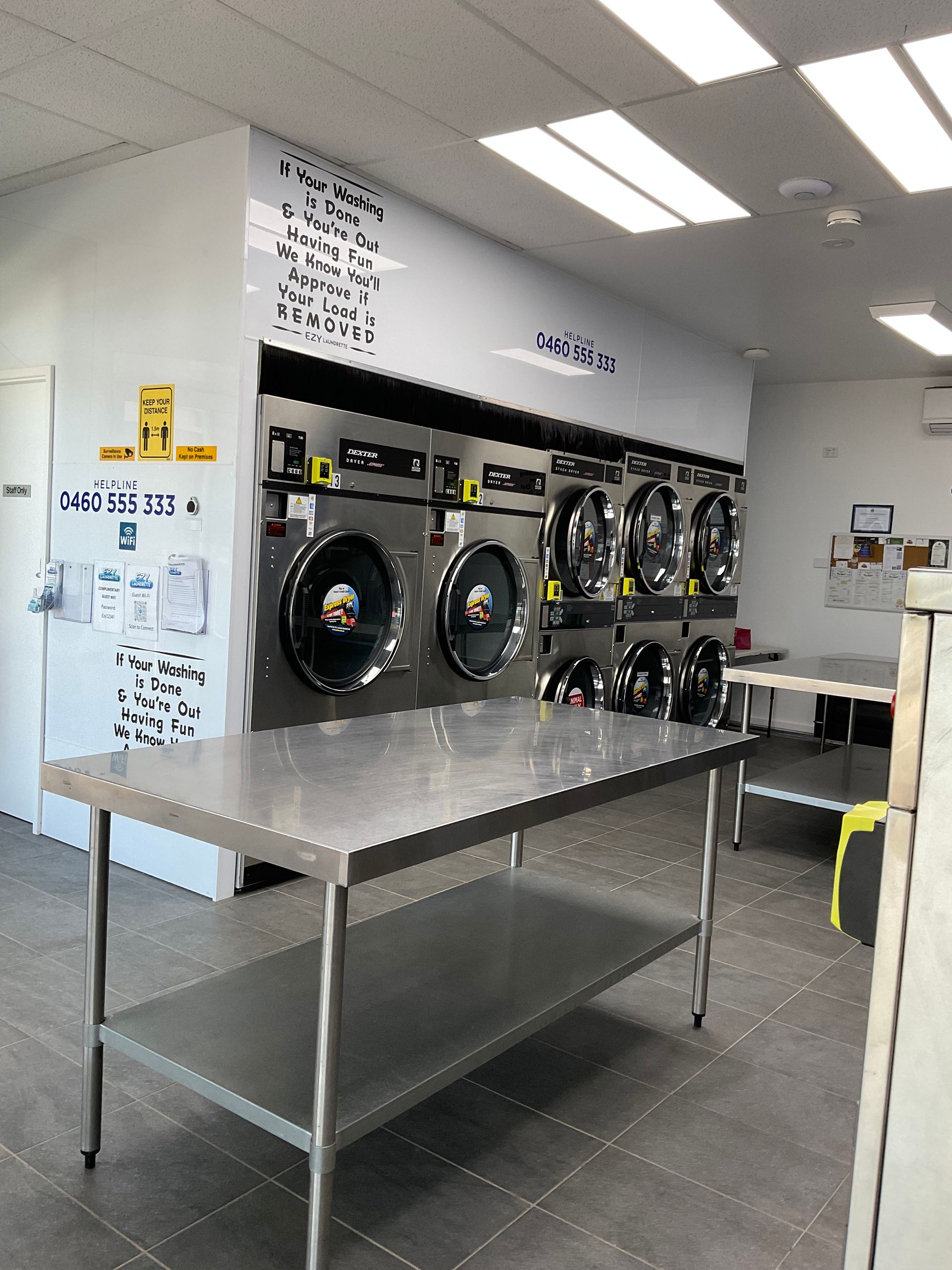 A Laundromat Interior With Washing Machines — Ezy Laundrette Diamond Beach in Wingham, NSW