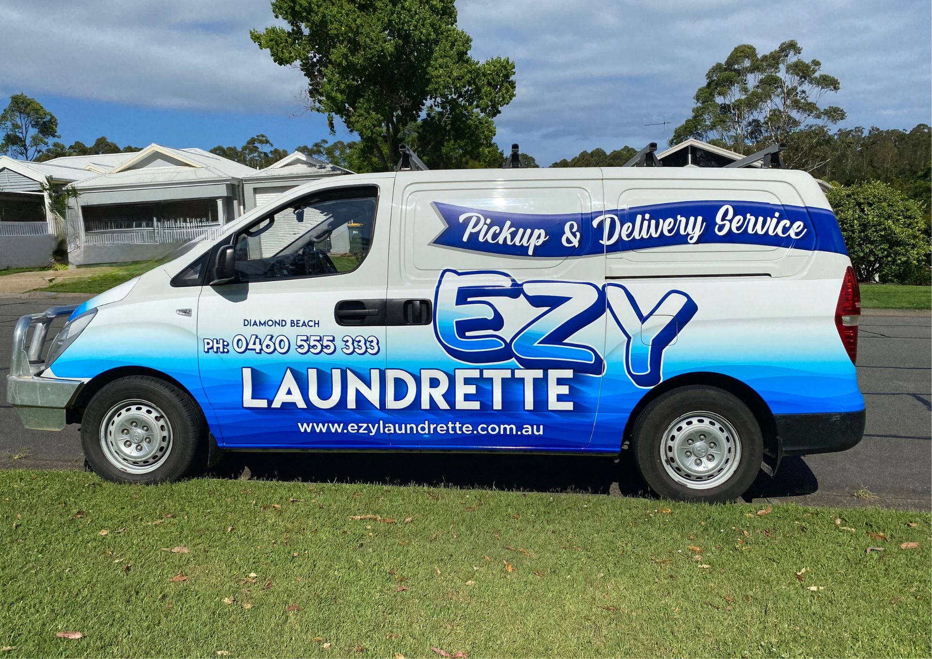 A White And Blue Van Parked On Grass — Ezy Laundrette Diamond Beach in Diamond Beach, NSW