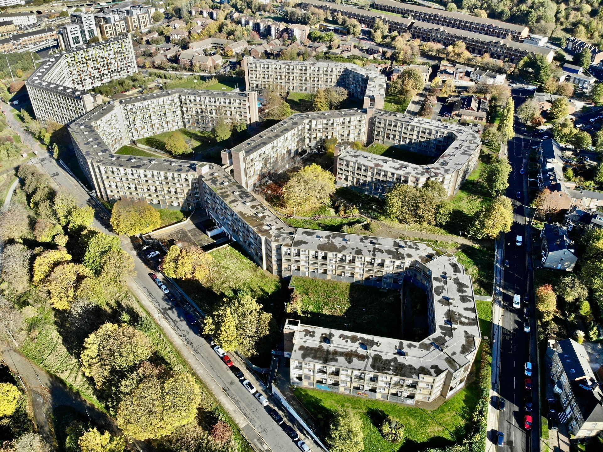 An aerial view of a residential area with lots of buildings and trees.