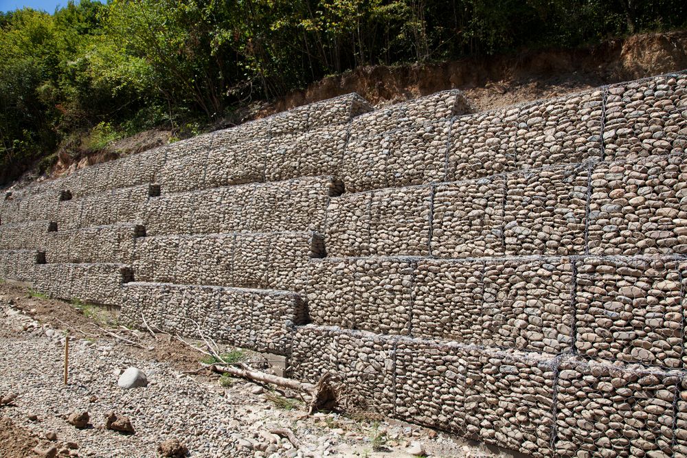 Stone-Filled Gabion Retaining Wall on a Hillside — STJ Earthmoving in Ravenshoe, QLD