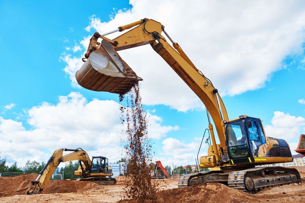 Two Yellow Excavators on a Construction Site — STJ Earthmoving in Archer River, QLD