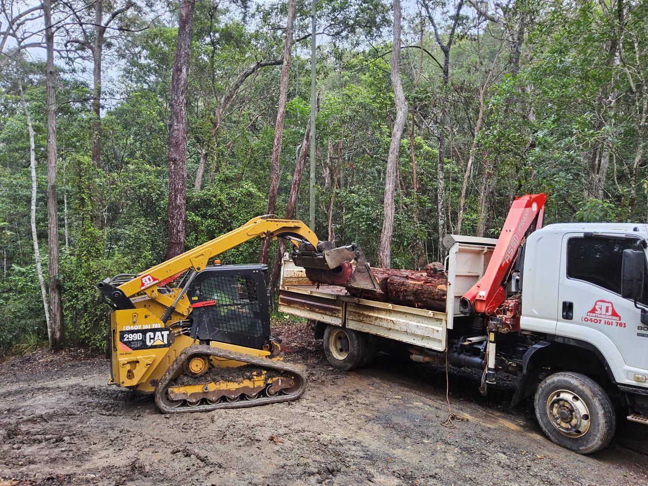 A Large Excavator is Digging in the Dirt on a Construction Site — STJ Earthmoving in Mareeba, QLD
