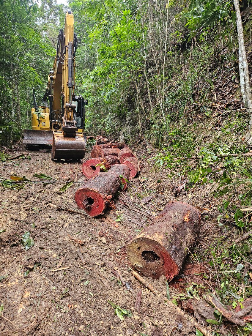 A Bulldozer is Working on a Rocky Hillside — STJ Earthmoving in Mareeba, QLD