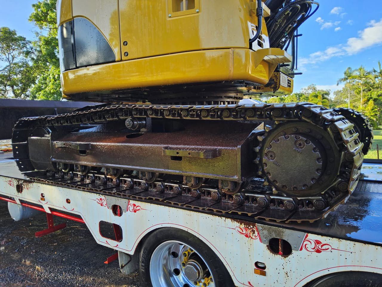 A Bulldozer is Driving Through a Pile of Dirt — STJ Earthmoving in Mareeba, QLD