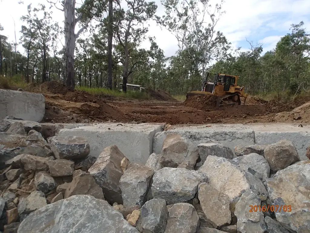 Construction Site with A Bulldozer Clearing Dirt — STJ Earthmoving in Mareeba, QLD