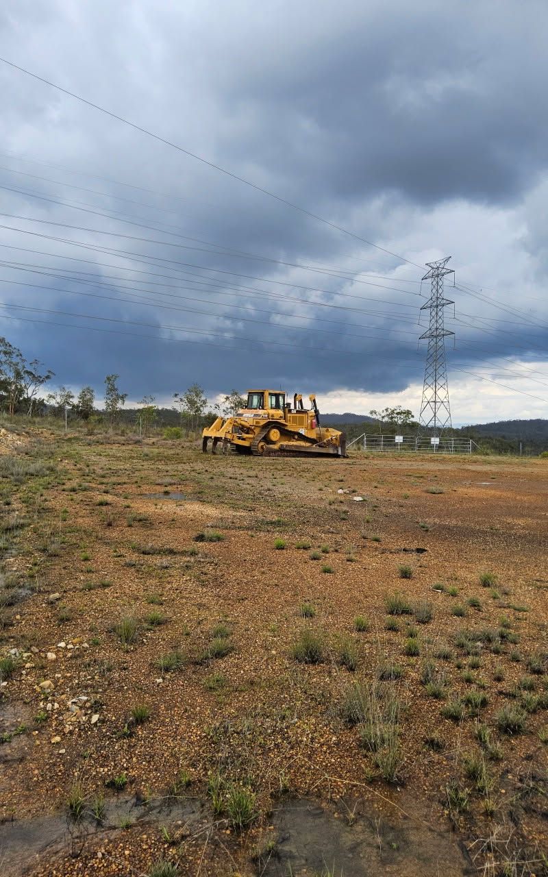 Yellow Bulldozer Parked on a Barren — STJ Earthmoving in Kowanyama, QLD
