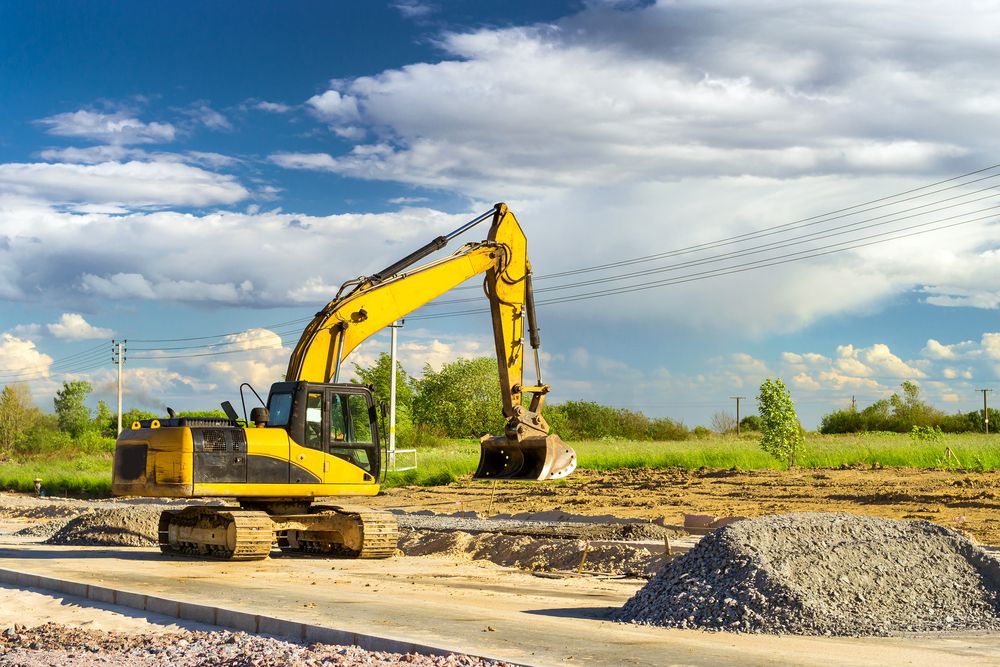 Yellow Excavator on a Construction Site — STJ Earthmoving in Normanton, QLD