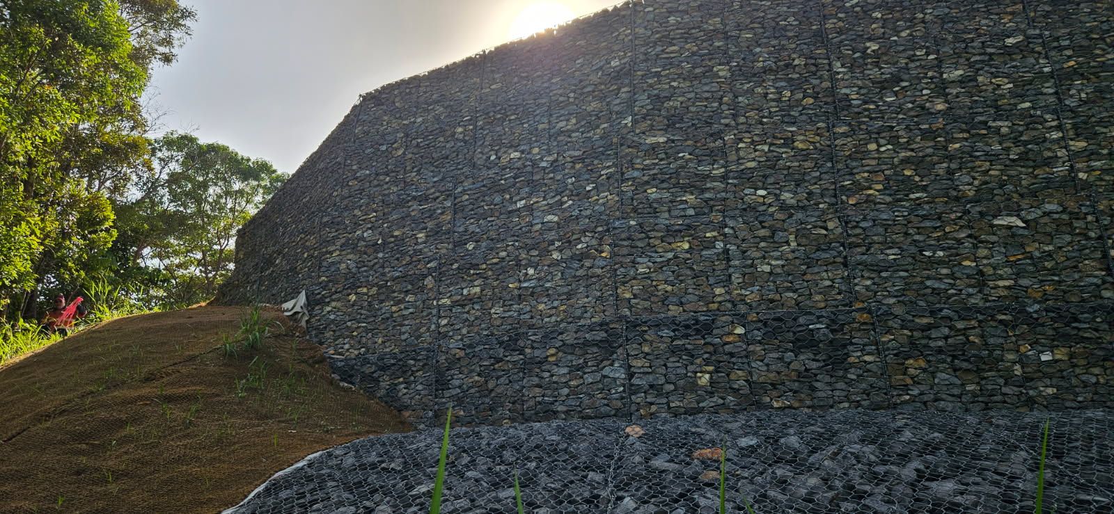 A Bulldozer is Working on a Rocky Hillside — STJ Earthmoving in Atherton, QLD