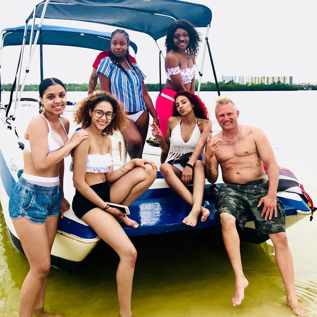 A group of people are posing for a picture on a boat