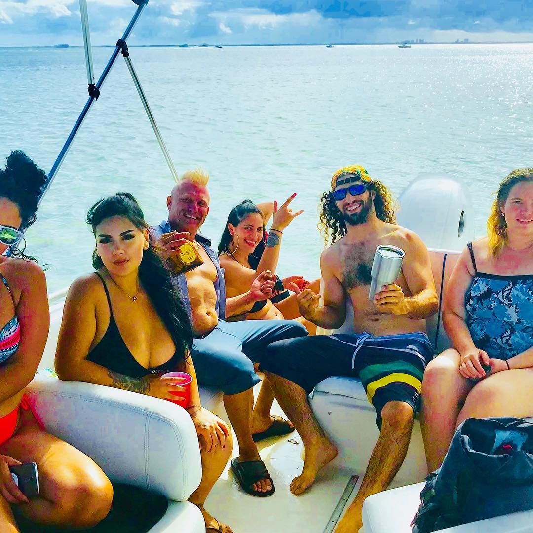 A group of people are sitting on a boat in the water