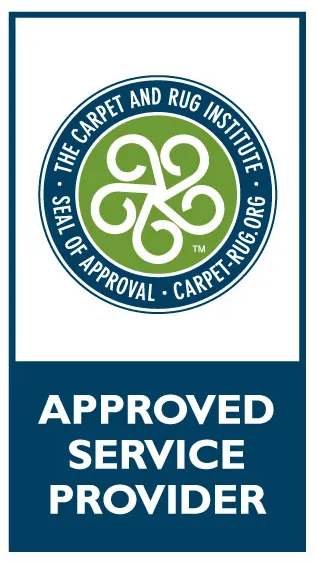 Blue-green Carpet and Rug Institute “Approved Service Provider” badge with seal logo