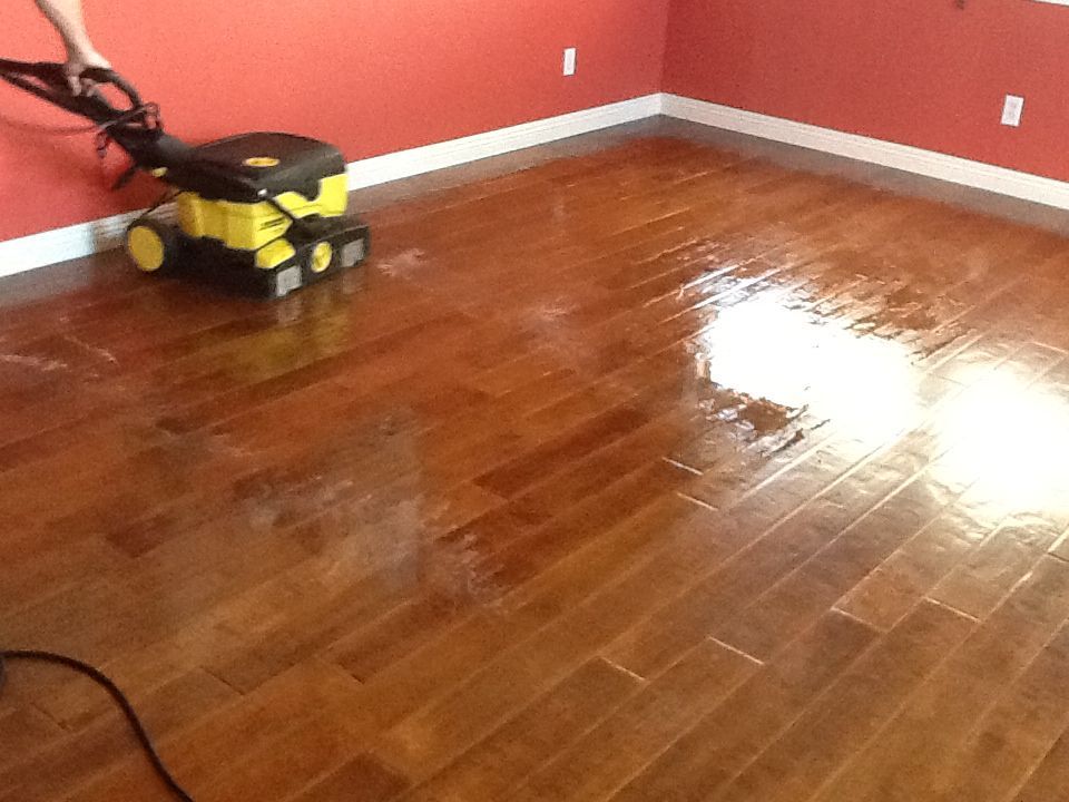 Hardwood floor refinishing and cleaning service for a smooth and glossy finish.