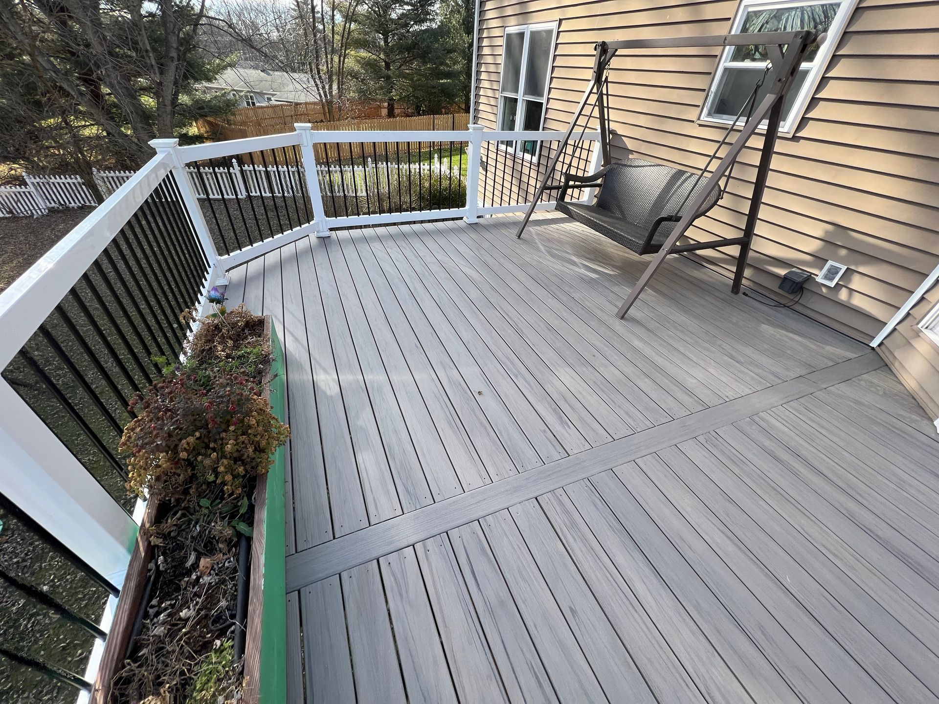 a wooden deck is being built on the side of a house