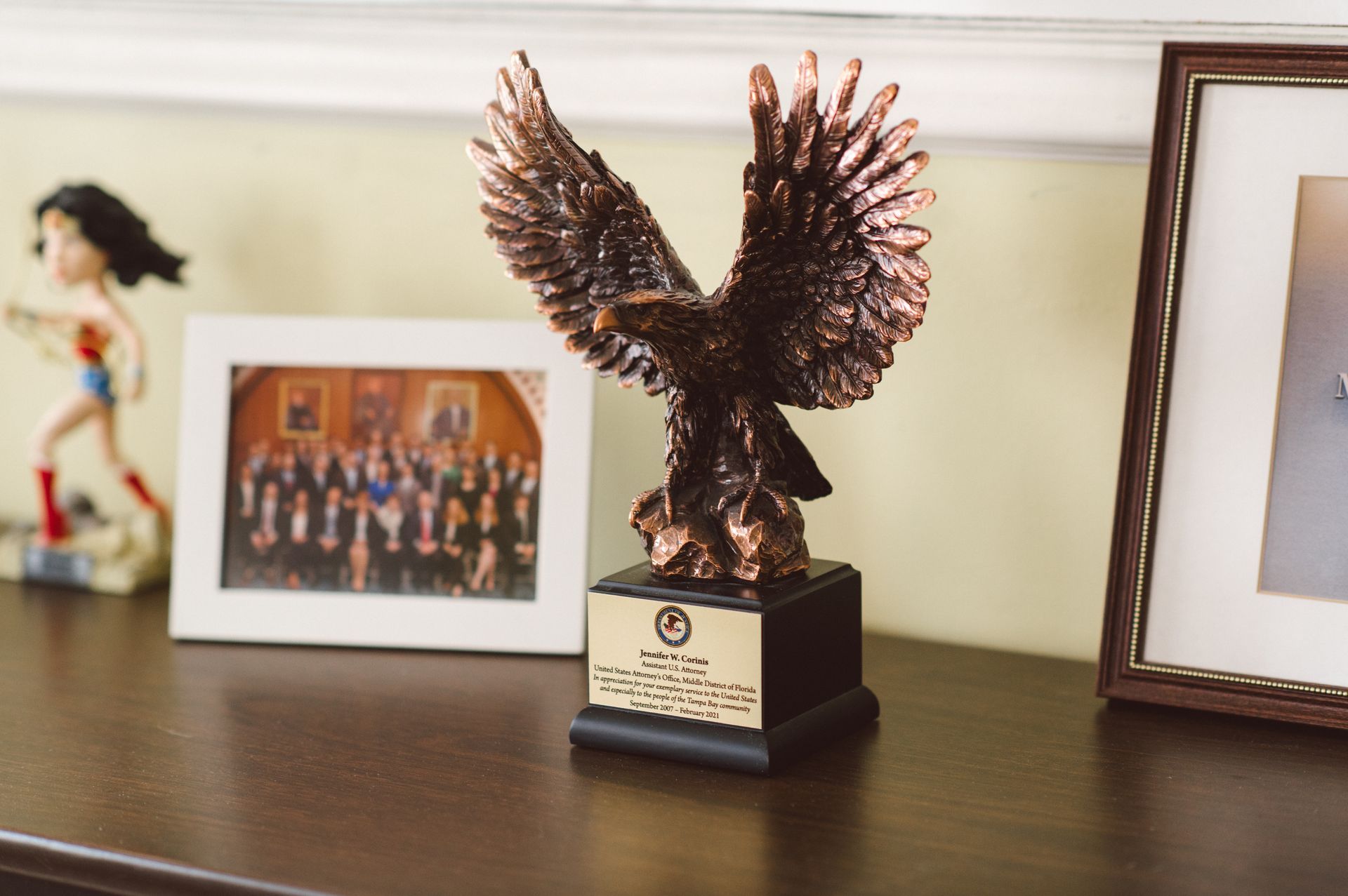 a trophy with an eagle on top